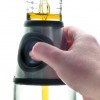 Dosificador-medidor de aceite de lacor